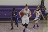 Katelyn Cole brings the ball down the court against Hanford West.